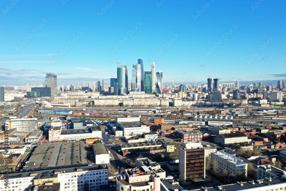 panoramic views of skyscrapers and infrastructure of a large metropolis taken from a drone