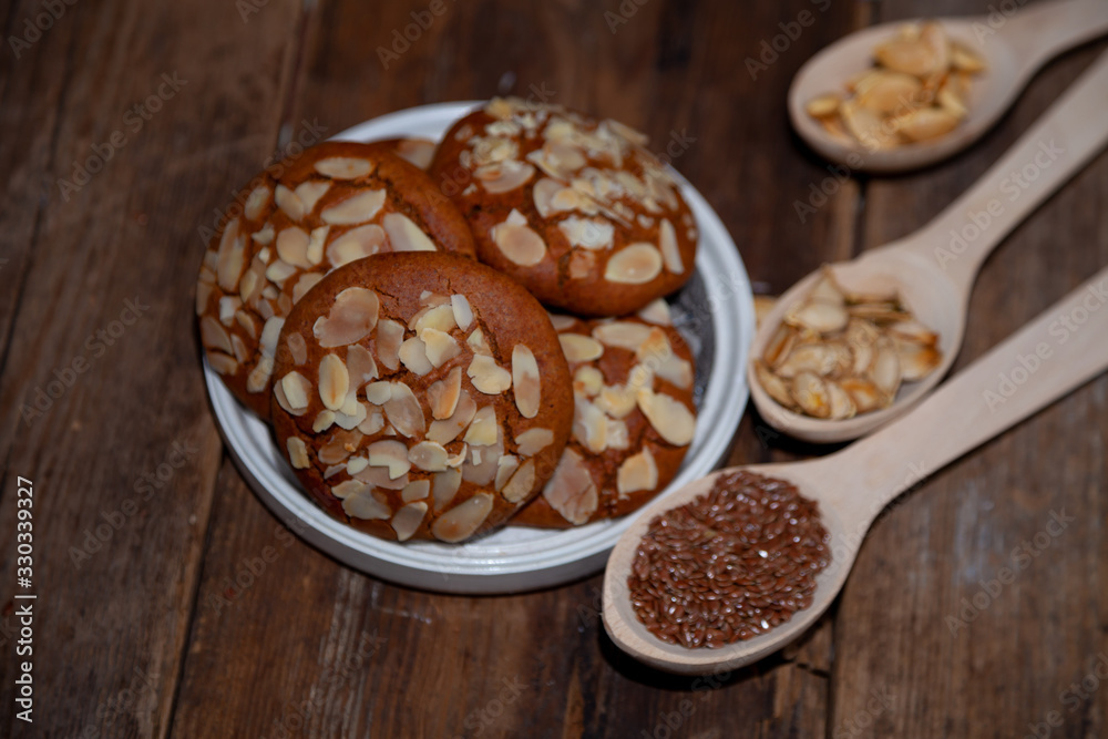 Almond Chip Cookies. Almonds on a round homemade cookie. Still life, food closeup on a wooden table. Appetizing pastries. Almond Chip Cookies. Almonds on a round homemade cookie. Still life, food closeup on a wooden table. Appetizing pastries.