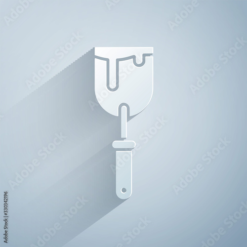 Paper cut Putty knife icon isolated on grey background. Spatula repair tool. Spackling or paint instruments. Paper art style. Vector Illustration