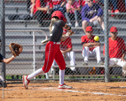 Girl Fastpitch Softball player in action during a competitive game
