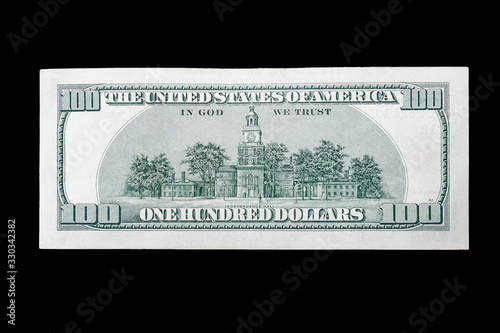 backside money usa 100 american dollars on isolated black background