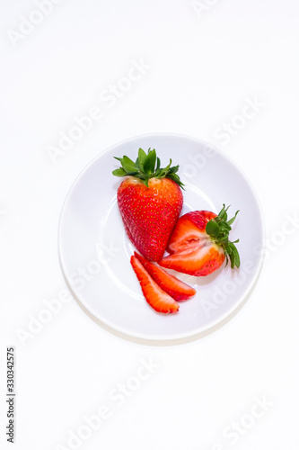 Ripe red berry, strawberries on a black background. Isolated item.