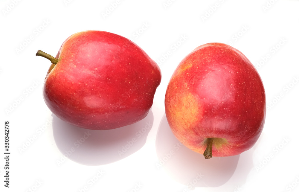 two red apples on a white background two red apples on a white background