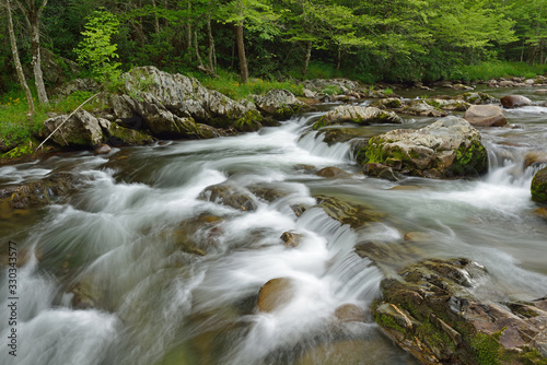 Spring landscape of a cascade and rapids on the Little Pigeon River captured with motion blur  Great Smoky Mountains National Park  Tennessee  USA