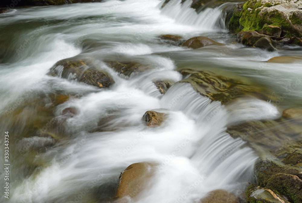 Spring landscape of a cascade and rapids on the Little Pigeon River, Great Smoky Mountains National Park, Tennessee, USA Spring landscape of a cascade and rapids on the Little Pigeon River, Great Smoky Mountains National Park, Tennessee, USA
