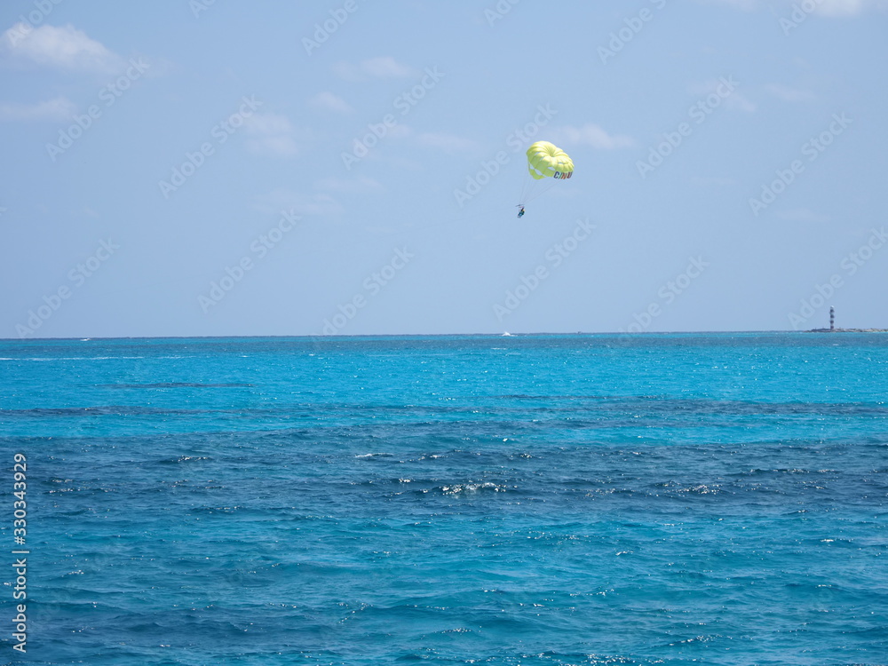 Surfer between Isla Mujeres and Cancun city in Mexico Surfer between Isla Mujeres and Cancun city in Mexico