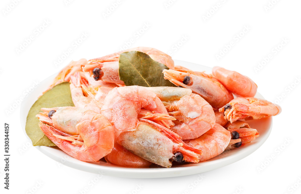 Cooked prawns with Bay leaf in a plate on a white background. Isolated Cooked prawns with Bay leaf in a plate on a white background. Isolated