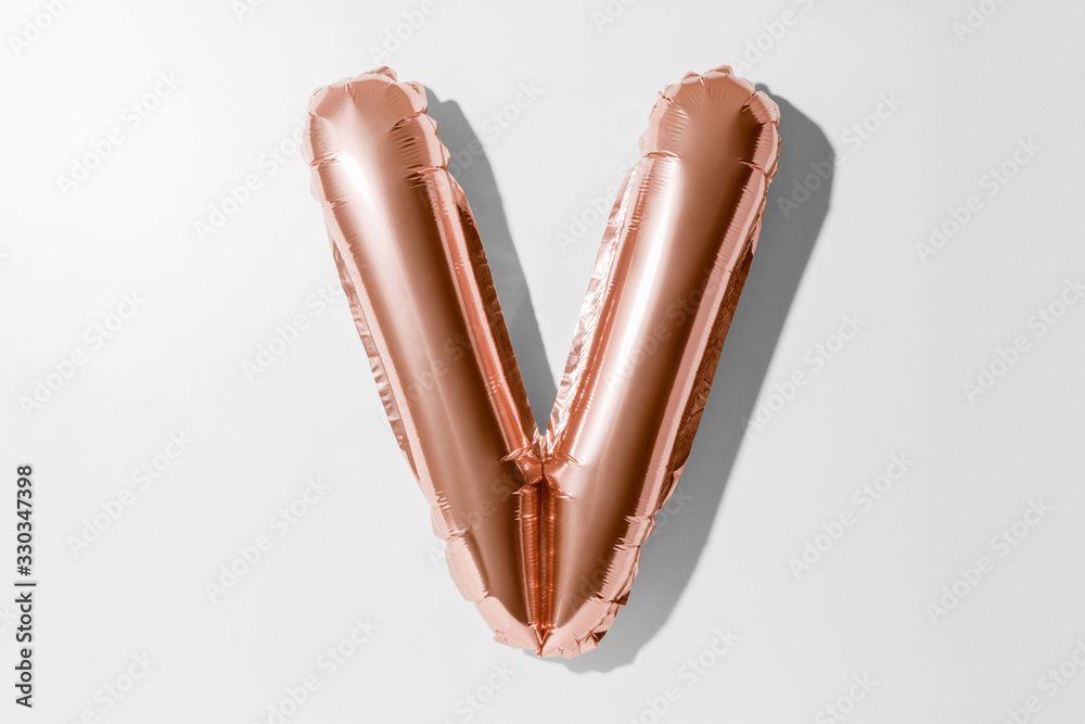 Obraz premium Letter V, Rose gold foil balloon alphabet isolated on white background with Clipping Path