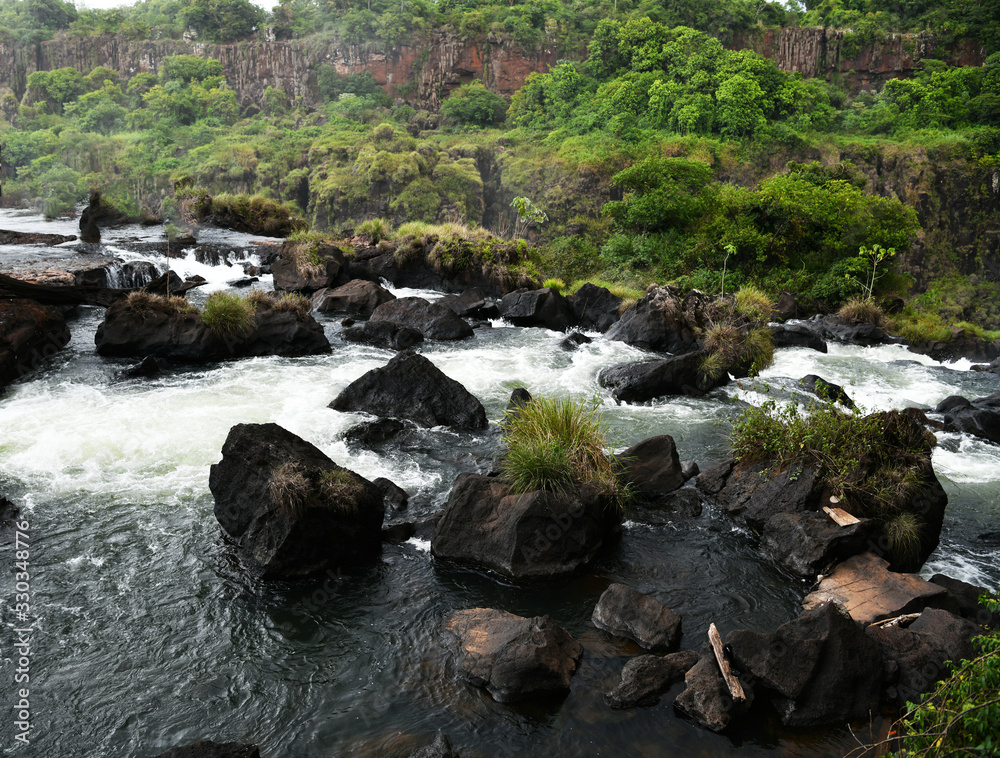 rushing waterfall and mountain river in the jungle rushing waterfall and mountain river in the jungle