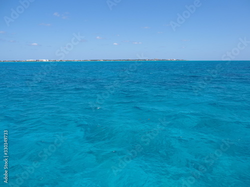 Clear water between Isla Mujeres and Cancun city in Mexico