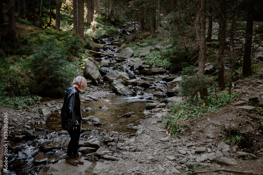 young woman hiking in the forest