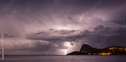 Lightning storm in the night sky over the mediterranean sea in San Antoni, Ibiza 