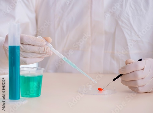 Male chemist working in lab