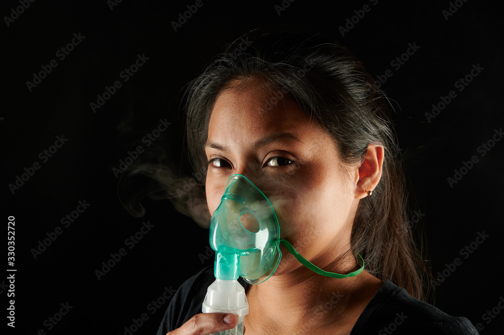 Latin woman with inhale mask