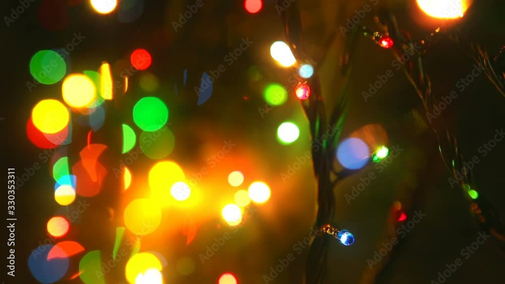Colorful lights. Festive mood. Abstract blurred Background. Festive lights close-up in the New Year Decor, multicolored Lighting. Background soft focus effect. Night illumination Colorful lights. Festive mood. Abstract blurred Background. Festive lights close-up in the New Year Decor, multicolored Lighting. Background soft focus effect. Night illumination