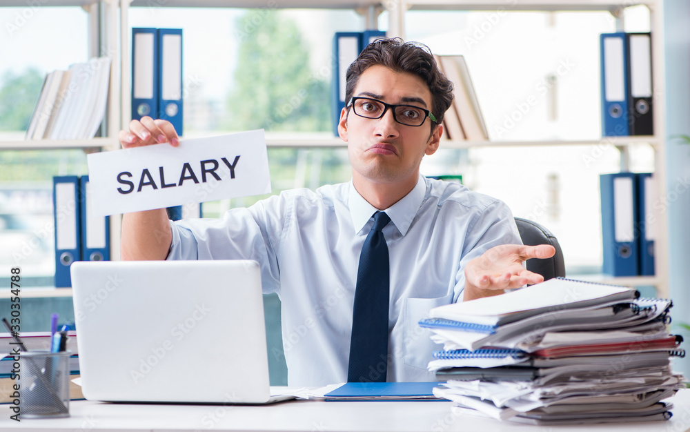 Young businessman asking for salary increase in office Young businessman asking for salary increase in office
