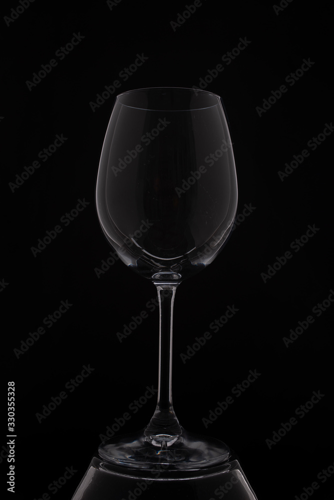 empity red wine glass on black background empity red wine glass on black background