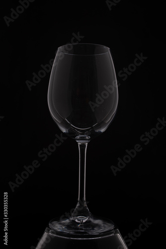 empity red wine glass on black background