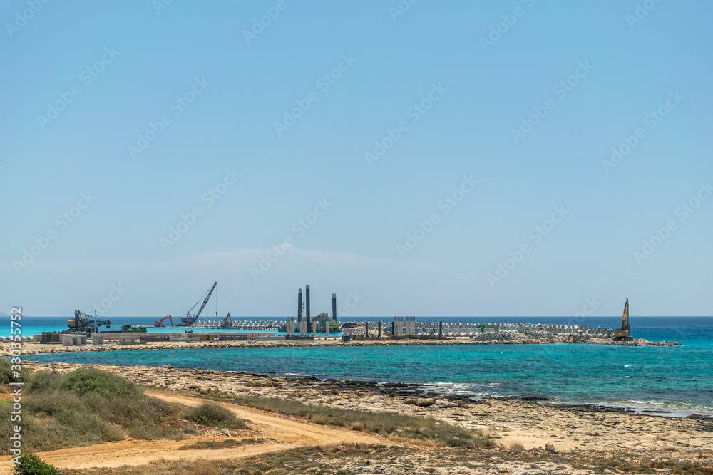 CYPRUS, AYIA NAPA MARINA - MAY 12/2018: builders are working on the construction of a seaport.