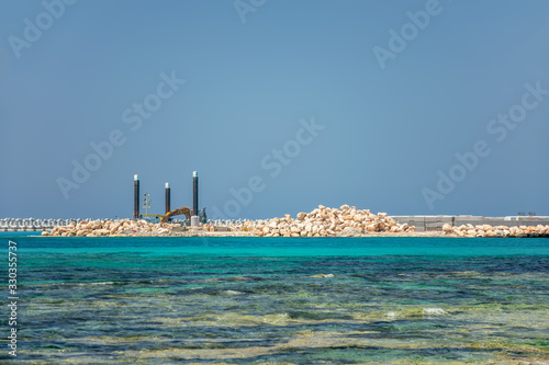 CYPRUS, AYIA NAPA MARINA - MAY 12/2018: builders are working on the construction of a seaport.