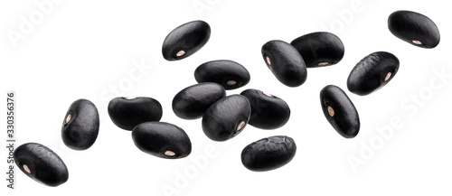 Falling black beans isolated on white background photo