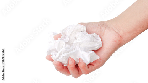 Used tissue paper with a woman's hand isolated on a white background