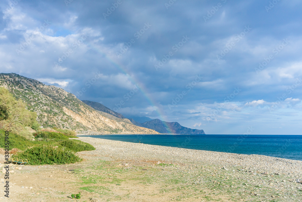 The city of Palaiochora, Paleochora in Crete, Greece, in its beauty with the Crocodile rock behind it The city of Palaiochora, Paleochora in Crete, Greece, in its beauty with the Crocodile rock behind it