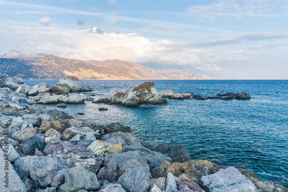 The city of Palaiochora, Paleochora in Crete, Greece, in its beauty with the Crocodile rock behind it The city of Palaiochora, Paleochora in Crete, Greece, in its beauty with the Crocodile rock behind it