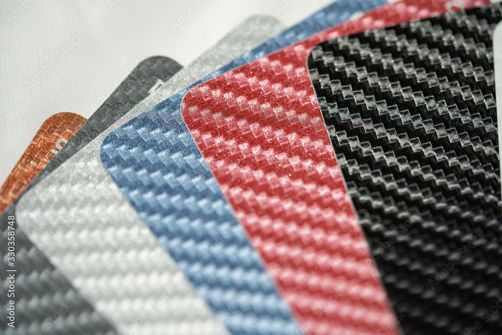Close-up of Carbon fiber palette guide of stickers for decoration. Car wrapping. Close-up of Carbon fiber palette guide of stickers for decoration. Car wrapping.
