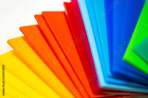Colorful pieces of plexiglass. Isolated on white background.