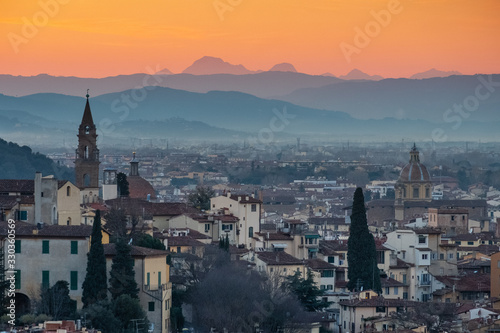 A Florentine sunset leaves the Tuscan hills orange