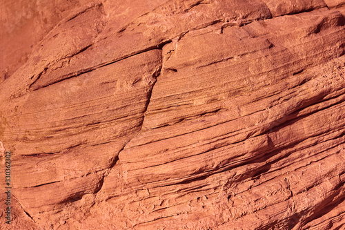 Light coral brown background and texture of natural stone, colored rock surface for design © photobyevgeniya