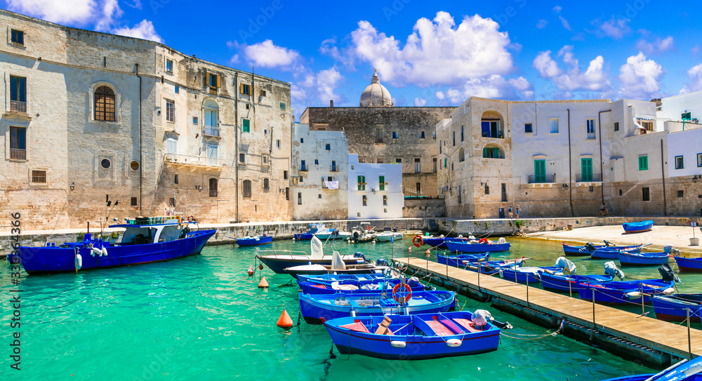 Traditional Italy - white town Monopoli with colorful fishinng boats. Puglia, Italy