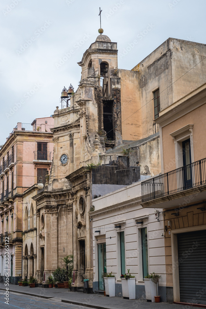 Row of buildings with San Rocco church in Acireale city on Sicily Island, Italy