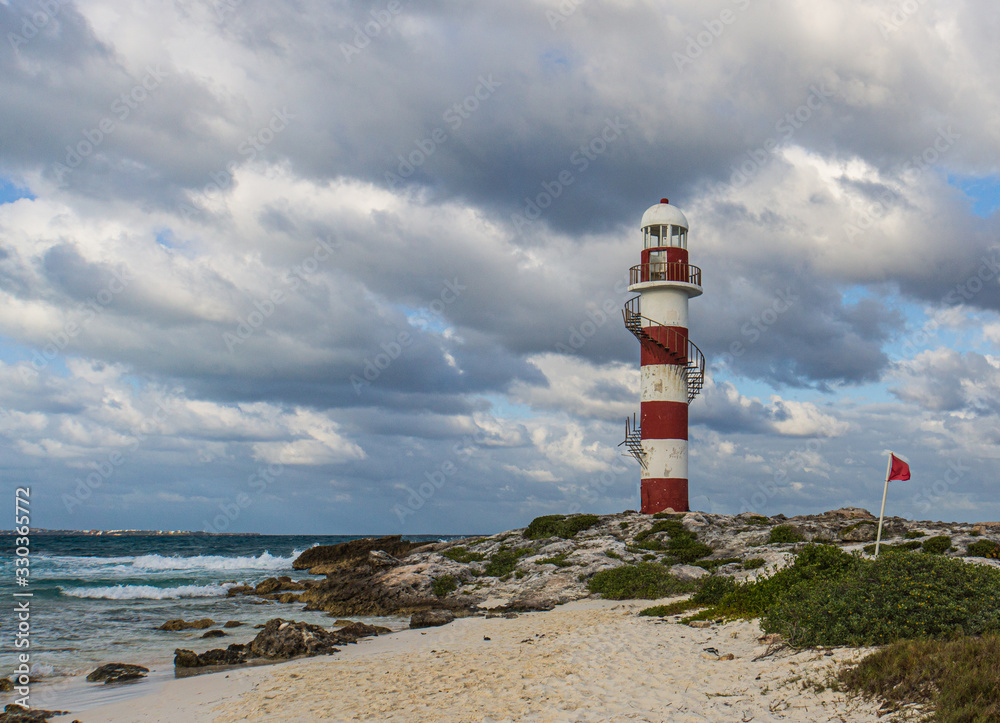 old historic lighthouse in Cancun, Mexico of Caribbean Sea Coast old historic lighthouse in Cancun, Mexico of Caribbean Sea Coast