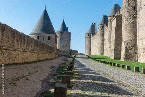 Carcassonne is one of the most beautiful fortified cities in France with double walls #330365792