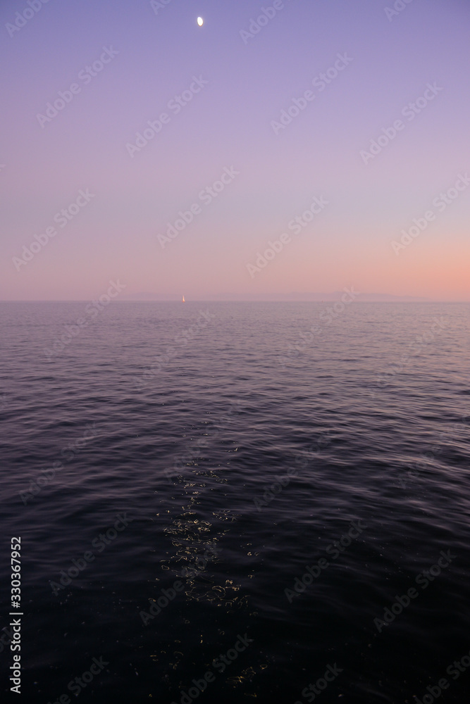 SANTA CRUZ, CALIFORNIA, USA - OCTOBER 7, 2019: Ocean view from Santa Cruz Wharf at sunset