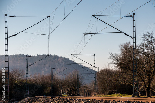 Power lines and rails along the countryside ready for transport