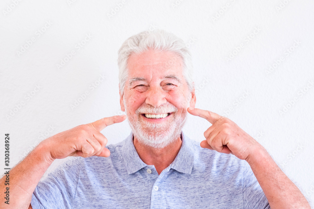 Cheerful old senior man portrait - mature people smile and have fun with white clear background - studio shot of white hair caucasian male Cheerful old senior man portrait - mature people smile and have fun with white clear background - studio shot of white hair caucasian male