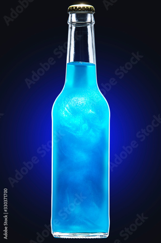 Blue carbonated alcoholic drink in a glass bottle saturated with food-grade pearlescent suspension
