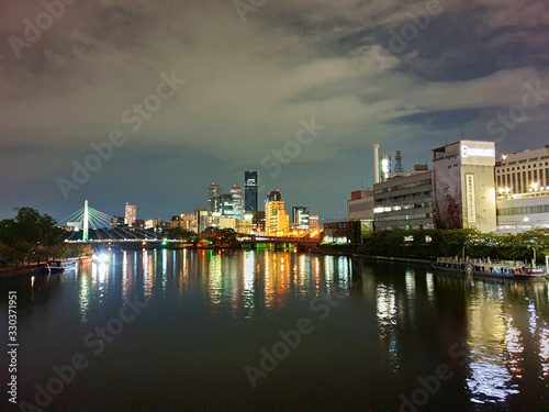 City reflection on the water at night