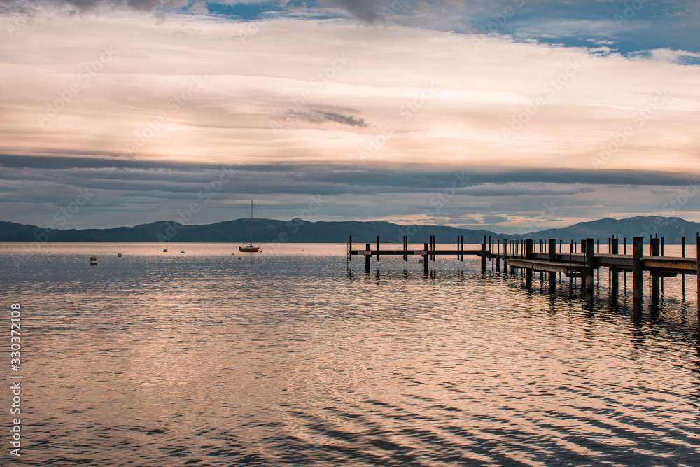 Sunset view of a sailboat and dock in Lake Tahoe, Homewood