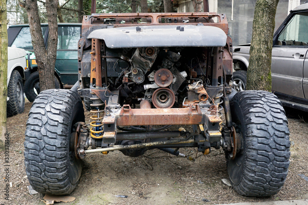 A wreck junk suv car in the street A wreck junk suv car in the street