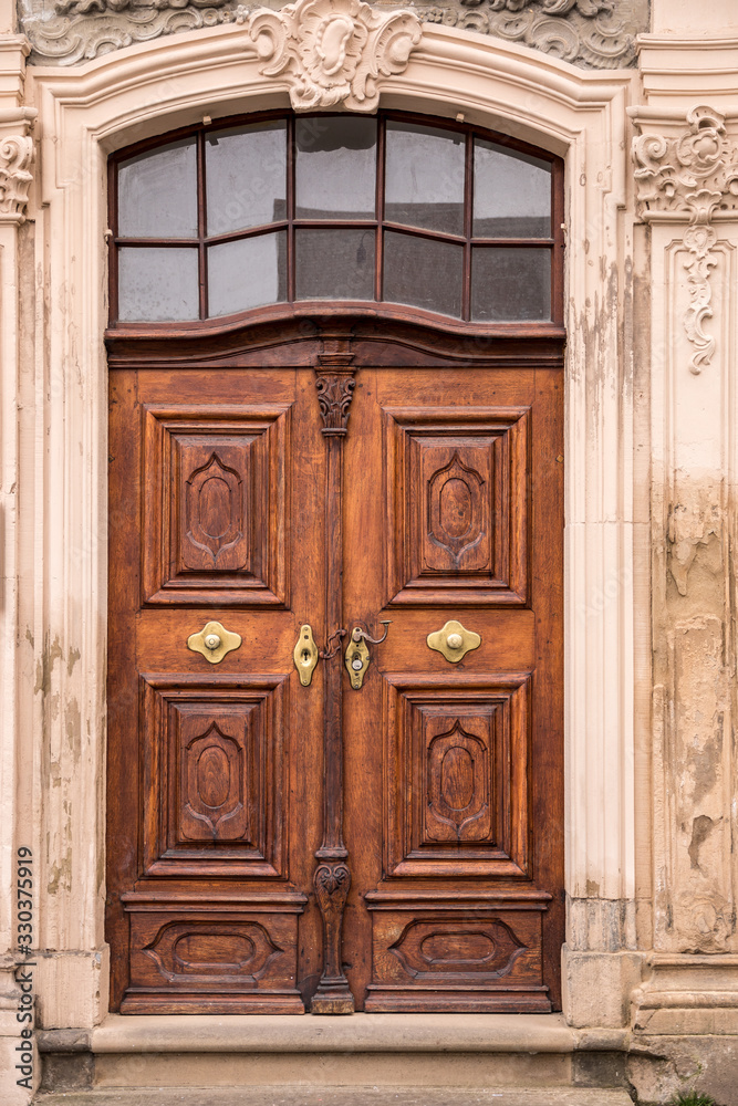 Old wooden door of an old historical building Old wooden door of an old historical building