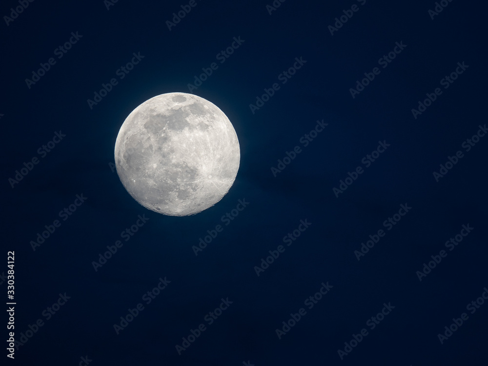 BERN, SWITZERLAND - MARCH 8, 2020: The full moon in the month of March over Bern