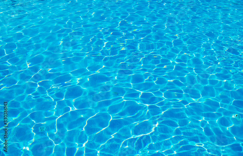 surface of blue swimming pool,background of water in swimming pool. © nata777_7
