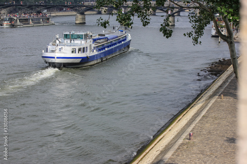 The Seine River in Paris and a tourist ship