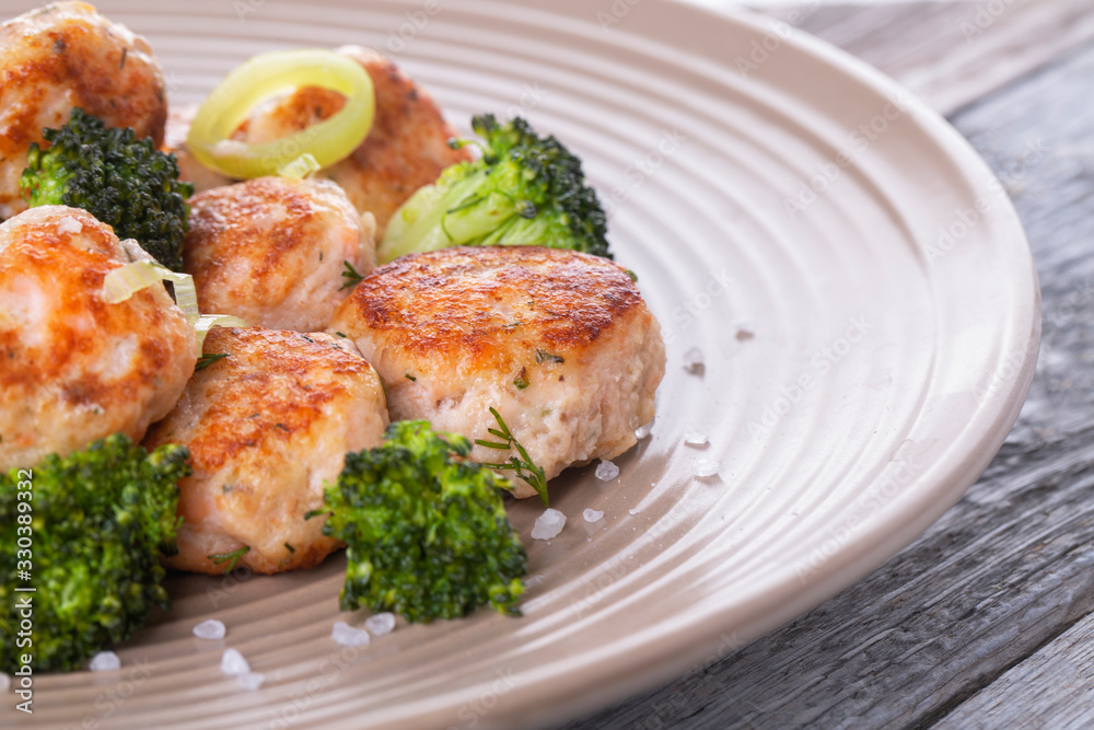 Plate of salmon meatballs with vegetables Plate of salmon meatballs with vegetables