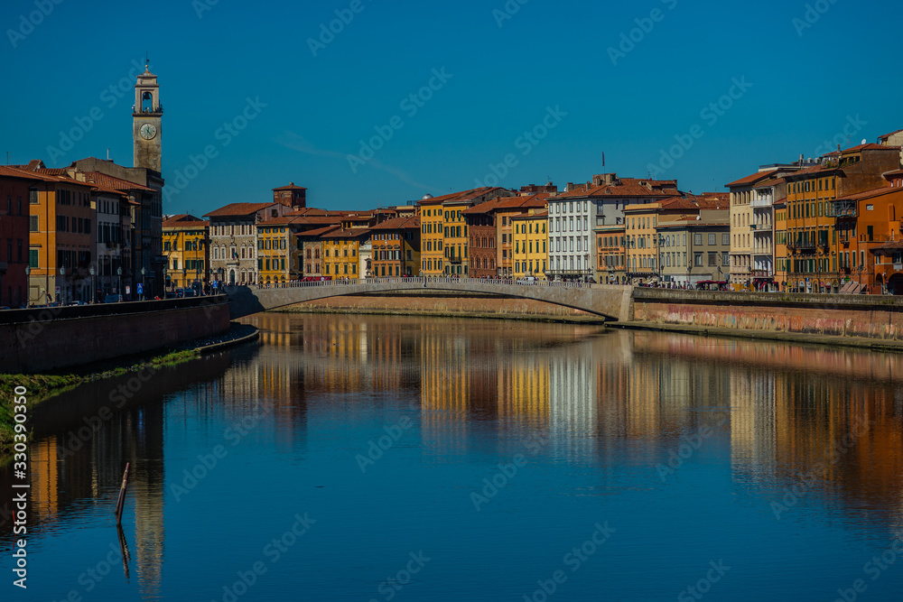Pisa in Tuscany, view the river Arno with bridge in historical center