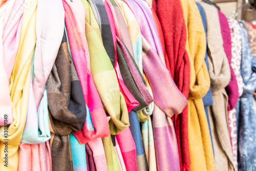 scarves colorful vibrant colors, on display in shopping street market in Firenze, Florence, Italy © Italyteam
